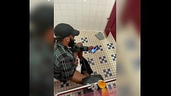 black dude jerking off watching porn and cums in his hands