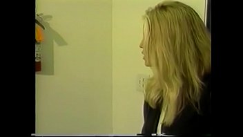 Gorgeous young blonde with k. tits and ass masturbates her slit with glove