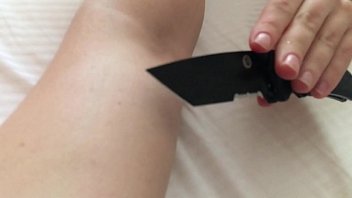 My girlfriend play with knife on my hand