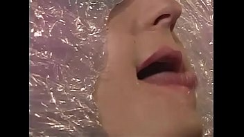 A sexy slave wrapped in the cellophane is fucked doggystyle in the bathroom