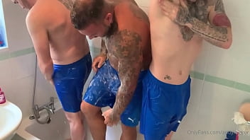 Three straight muscle friends showering