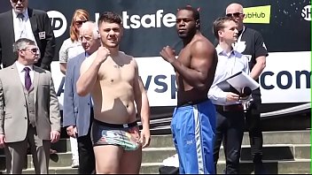 white nude man compares his huge bulge with black guy in public